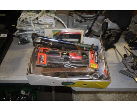 A box of tools including adjustable spanner, spanners, silicone gun etc