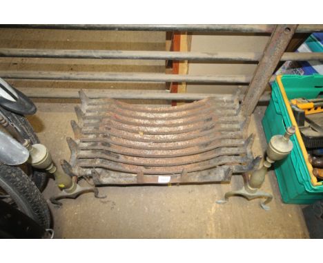 A fire grate and two fire dogs