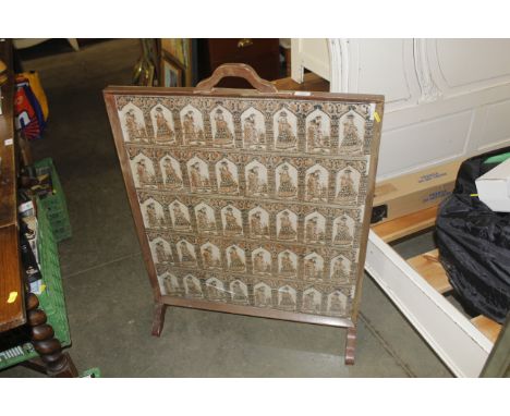 A fire screen with printed fabric panel 