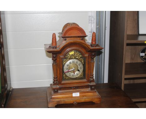 A cased mantle clock (battery operated)