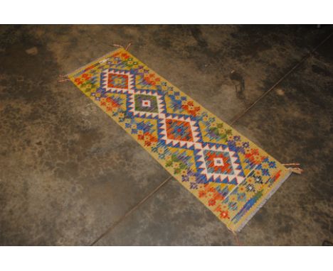 An approx. 4'11" x 1'8" Kilim runner