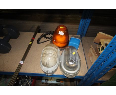 A flashing beacon light and two out wall light fittings