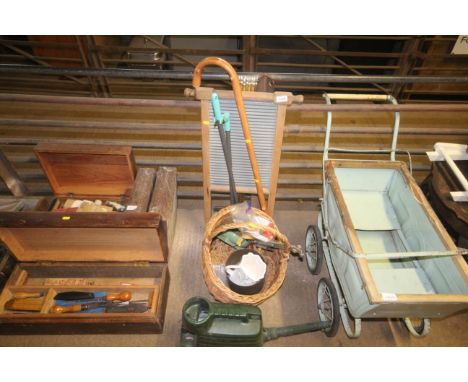 A watering can, a wicker basket, a walking stick, wash board etc
