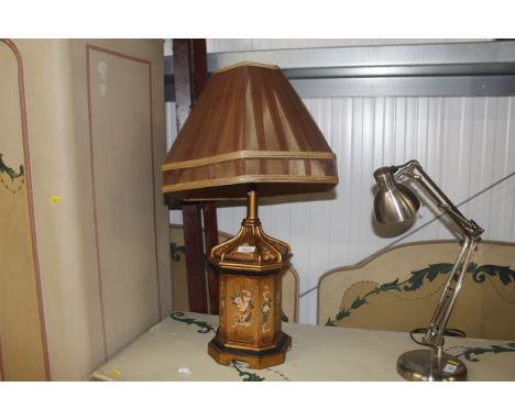 A decorative table lamp and shade