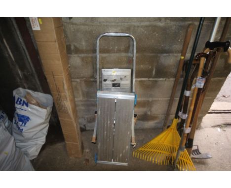 A small metal step ladder and a fold out work platform