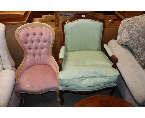 A reproduction mahogany framed armchair and a button back nursing chair