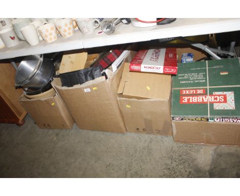 Four boxes containing various kitchenalia to include saucepans; bread bin; tins etc. together with various board games and pu