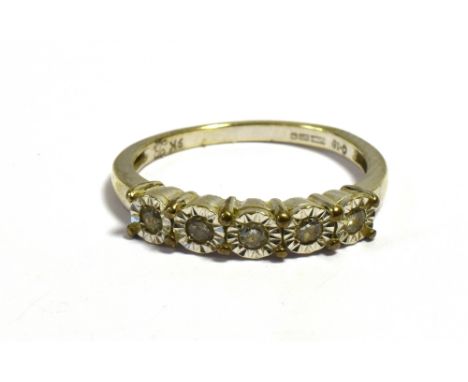 A 9CT WHITE GOLD ILLUSION SET RING  With 0.15 carats of brilliant cut diamonds, mounted in bright cut illusion settings, ring