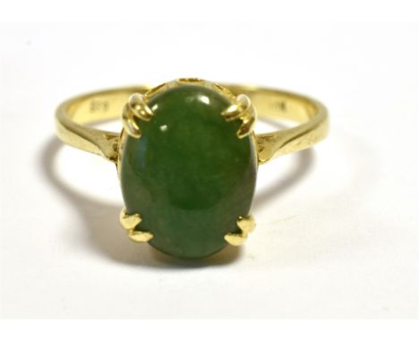 A 14CT GOLD JADEITE JADE DRESS RING  Claw set 9.9 x 7.6mm oval jadeite jade cabochon, assessed in the setting as A type, ring
