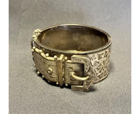 VICTORIAN SILVER BELT BUCKLE BANGLE 30.8mm wide, 5.9cm internal diameter, decorated with intricately engraved belt buckle to 