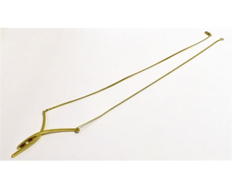 A 9CT GOLD RUBY AND DIAMOND LAVALIER  46cm long, wish bone style centre piece channel set with two 2.3mm round cut rubies and