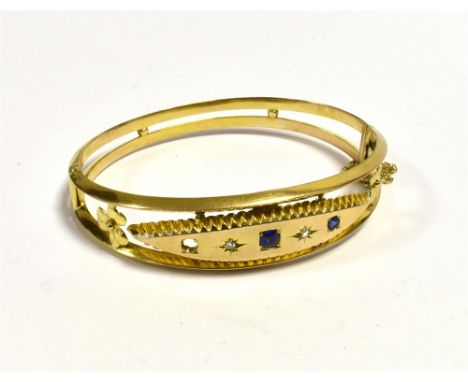 EDWARDIAN 9CT GOLD GEM SET BANGLE  15.5mm wide front with navette shaped centrepiece decorated with star grain set rose cut d