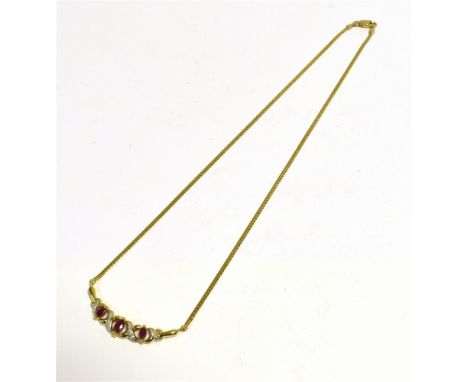 9CT GOLD DIAMOND &amp; RUBY LAVALIER  40cm long, with three marquise shaped rubies, alternating with grain set diamond ribbon