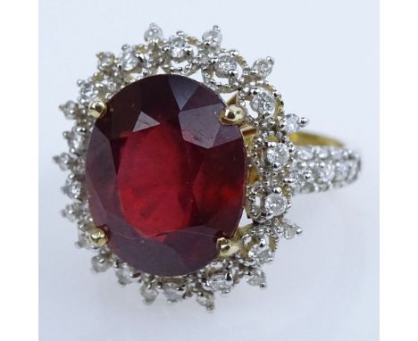 AIG Certified 8.91 Carat Oval Cut Ruby, .78 carat Round Brilliant Cut Diamond and 14 Karat Yellow Gold Ring. Ruby with vivid 