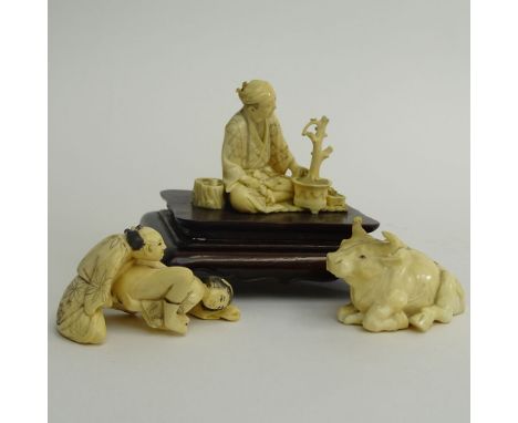 Two (2) Vintage Japanese Carved Ivory Okimono, Seated Man with Bonsai on Wood Base and Water Buffalo and a Japanese Carved Iv