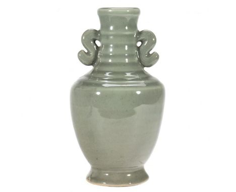 The grey-green stick neck vase with scrolled handles. 8in. (20cm) h. Condition:&nbsp; Minor chip to edge of foot.