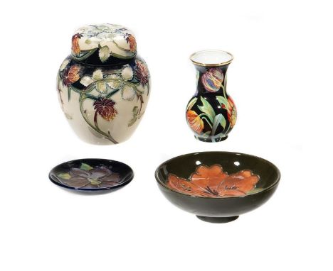 A Collection of Four Floral Decorated items, including a Covered Jar, Two Saucers and a Vase. Greatest height 5in. (12cm) Con