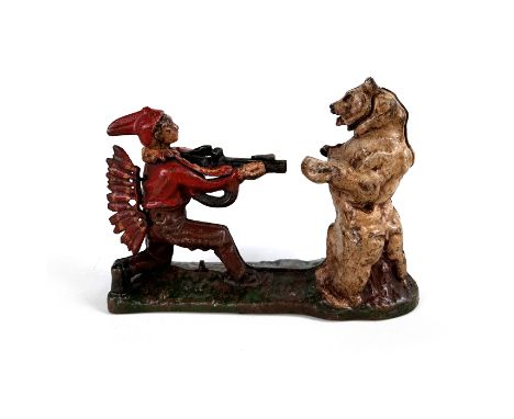 This item is a vintage cast iron mechanical money bank, designed with a Native American hunter and bear theme. The bank depic