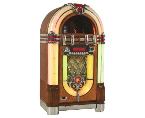 1946 Wurlitzer Model 1015 Jukebox. An older restoration, has some replaced plastics and veneer, however it is a good solid bo