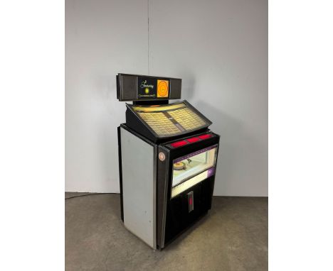 Rock-Ola 408 Rhapsody Jukebox. Fully working jukebox with good sound, full with records. Dimensions (H x W x D): 145 x 84 x 6