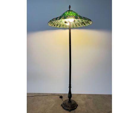 Tiffany style stained glass standing floor lamp with metal base and a "spear tip" top. The lamp has two bulb fixtures, step-o