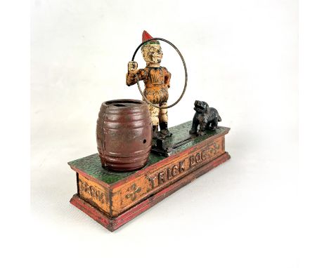 This Vintage Trick Dog Mechanical Coin Bank is a charming piece of Americana, likely dating back to the late 19th or early 20