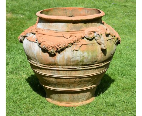 A GROUP OF VARIOUS MODERN GARDEN ORNAMENTS  To include a fibreglass imitation 'terracotta' urn with ram's-head decoration, 80