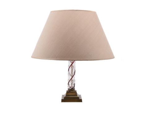 A CLEAR AND CRANBERRY GLASS TWIST TABLE LAMP20TH CENTURYWith twin light fitting, the capital of Corinthian order above a step