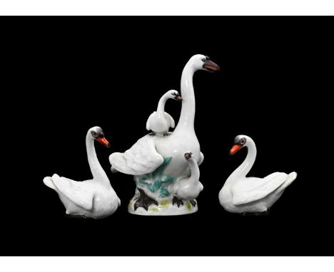 A BEVY OF MEISSEN MODELS OF SWANS20TH CENTURYComprising a larger group of a pen and her two cygnets, 13.5cm high, and two sma