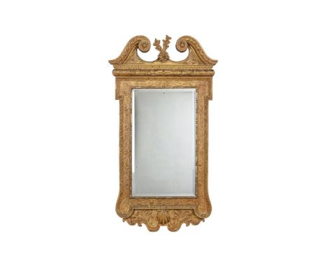 A GILTWOOD WALL MIRROR IN GEORGE II STYLEEARLY 20TH CENTURYAfter the manner of William Kent129cm high, 71cm wideCondition Rep