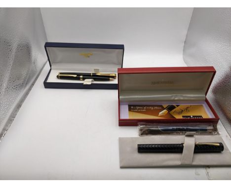 Boxed pens to include a black cased Sheaffer fountain pen, a Waterman fountain pen and an unmarked ballpoint pen in a Ronson 