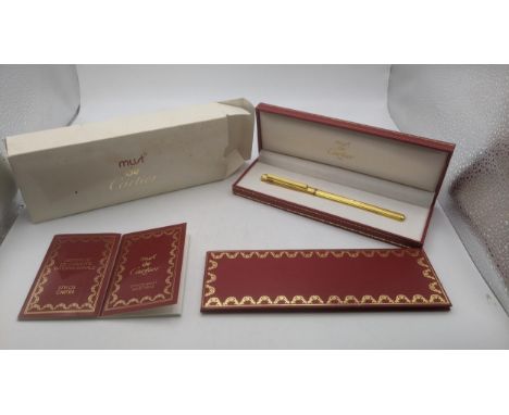 A gold plated Cartier Roller ball pen with box, cover and leather wallet containing certificate and user guide Location:If th