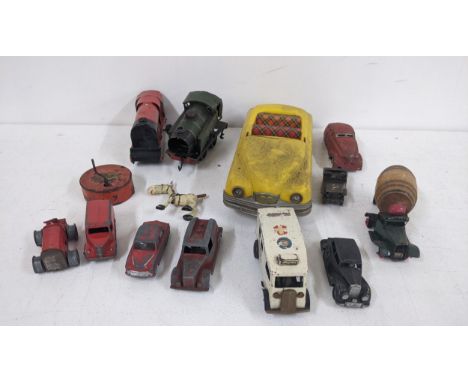 Assorted tinplate clockwork toys to include two trains, a Watneys truck, a Wee-Kim toy car and others Location:If there is no