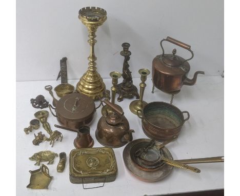 A metalware to include two copper kettles, a brass candle stand, a set of brass handled copper frying pans, a twin handled li