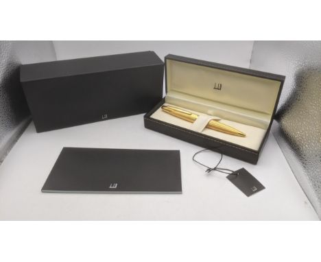 A gold plated Alfred Dunhill ballpoint pen with an engine turned case with box, cover and brochure Location:If there is no co