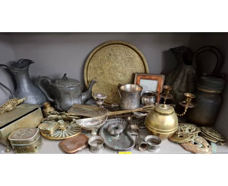 A quantity of mixed metalware to include an Indian brass tray, silver plated napkin rings, a candle snuff, a copper cigarette