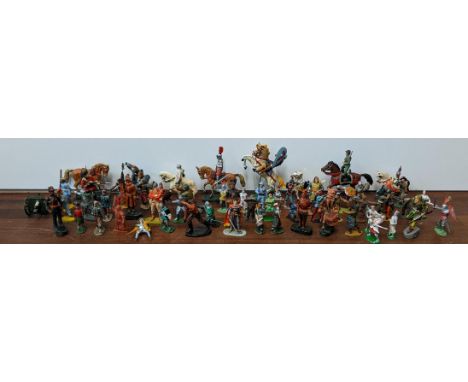 A collection of soldiers and military figures, mostly in combat uniform, some on horseback, to include models from Lone Star,