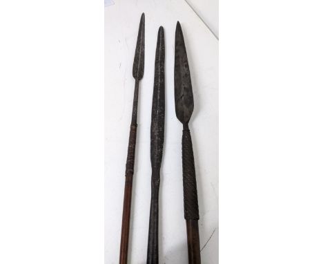 A group of three early 20th century African tribal art throwing spears, one a Masai tribe spear, another a South African Zulu