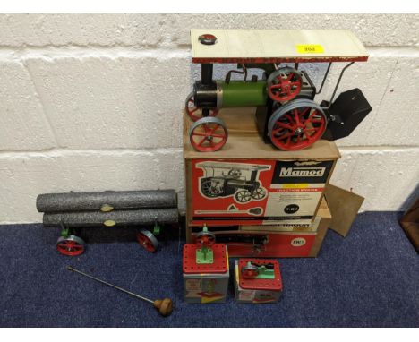 A Mamod Steam Tractor and Lumber Wagon along with a model power press and a model power hammer, all boxedLocation:If there is