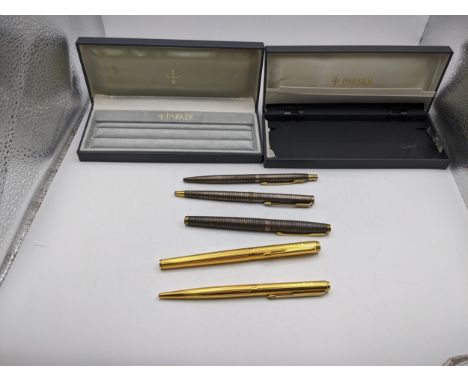 A collection of Parker pens to include a gold plated rollerball and ballpoint pen set (the ball point not having cartridge) a