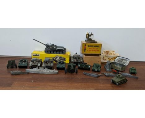 A collection of military vehicles, mainly tanks, to include a Solido Char Russe 'SU 100' tank, a Britain's field gun and othe