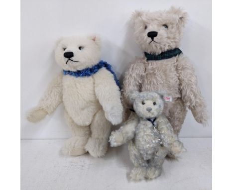 Three Steiff bears to include no 661747 Polar Ted wearing a fluffy blue scarf, no 408786 wearing a tartan collar and a Swarov
