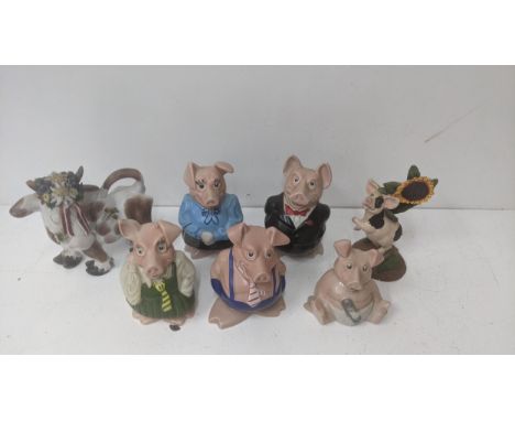 A group of ceramic figures to include five Wade Natwest pigs, an 'Innovation' ceramic model of a pig, sunflower and a studio 