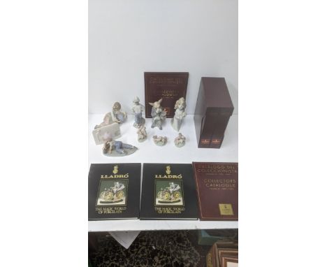A group of Lladro and Nao porcelain figurines, some signed to include 'All Aboard', 'World of Fantasy - Girl with Globe', and
