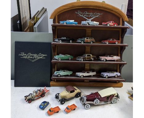 A collection of model cars to include a set of Franklin Mint 'The Classic cars of the Fifties' with a wall hanging display sh