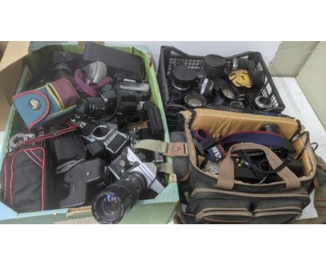 A large collection of photographic equipment to include a Praktica MTC SB camera, an Asahi Pentax camera, a vintage Kodak A11