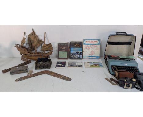 A mixed lot to include military trench art, a treen model of a ship, along with other treen items, an Olivetti portable typew