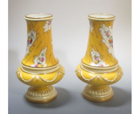 A pair of Royal Worcester yellow ground and floral painted vases by Harry Chair, 19cm high  