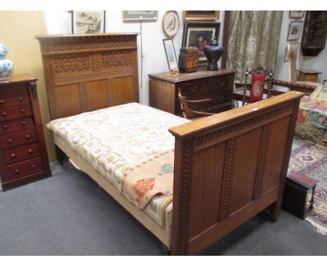 An oak framed bedstead, circa 1880 the headboard with dentil moulded cornice and strapwork carved panels, 114cm wide and an o