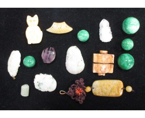 A collection of Chinese jade and hardstone pendants, beads etc.  